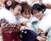 Japanese girls in Fukuoka enjoying mobile phone communication